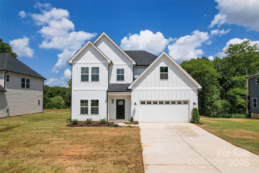 Front exterior of a new home in , Harrisburg, NC, highlighting curb appeal (Image 19).