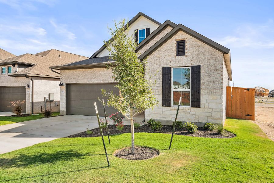 Front exterior of a new home in Lariat, Liberty Hill, TX, highlighting curb appeal (Image 19).