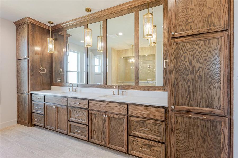 Love the rich trim work in this vanity complete with soft close cabinets and dual built-in hampers at each end. Love the rich trim work in this vanity complete with soft close cabinets and dual built-in hampers at each end.