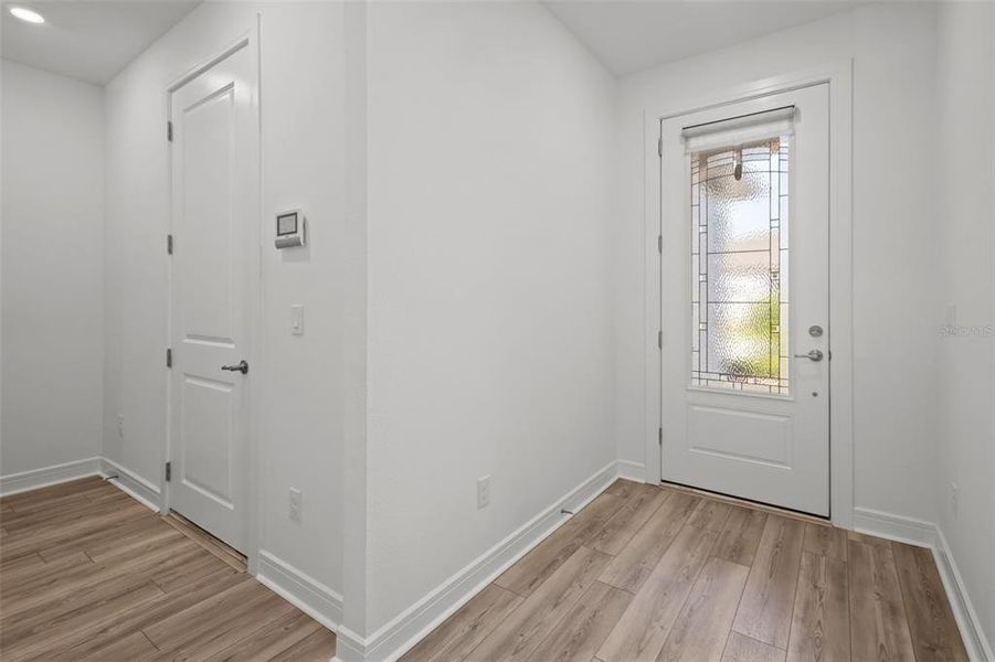 Entry - to the left is the door to tandem garage, laundry room is also to the left