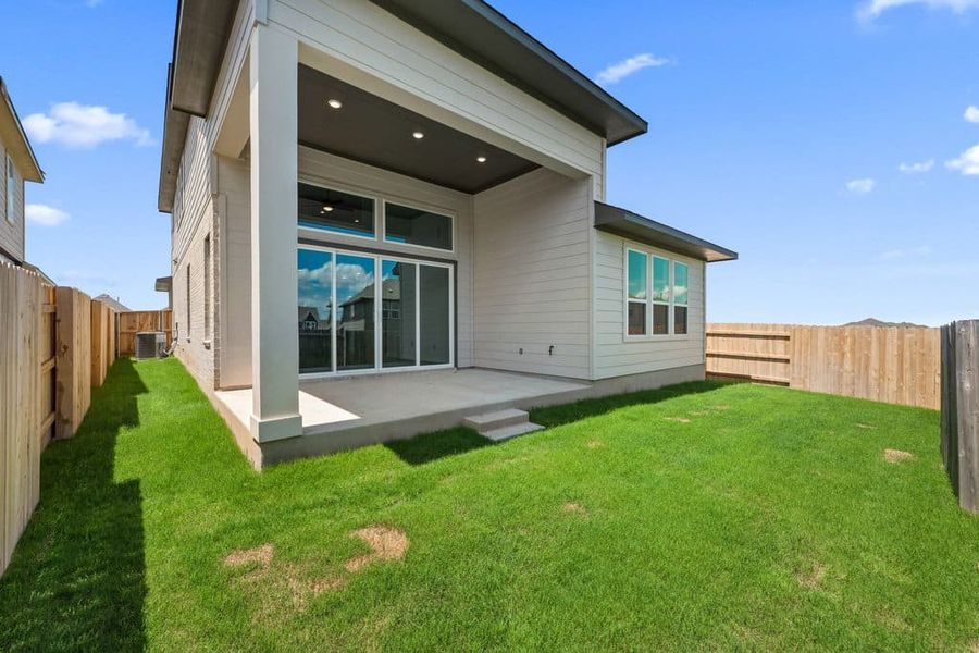 Exterior details and patio area of a home in Lariat, Liberty Hill (Image 4).