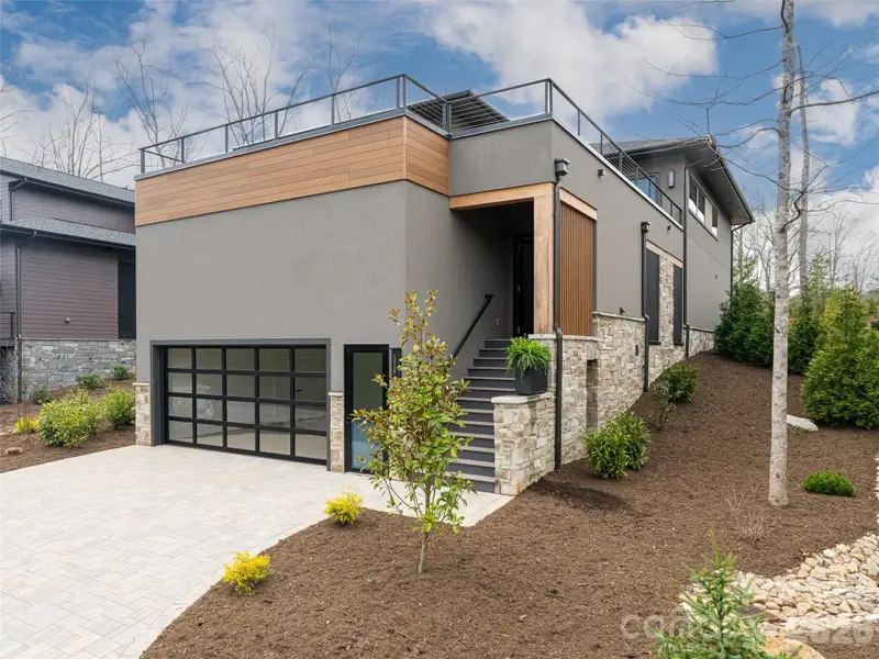 Front exterior of a new home in , Arden, NC, highlighting curb appeal (Image 29).