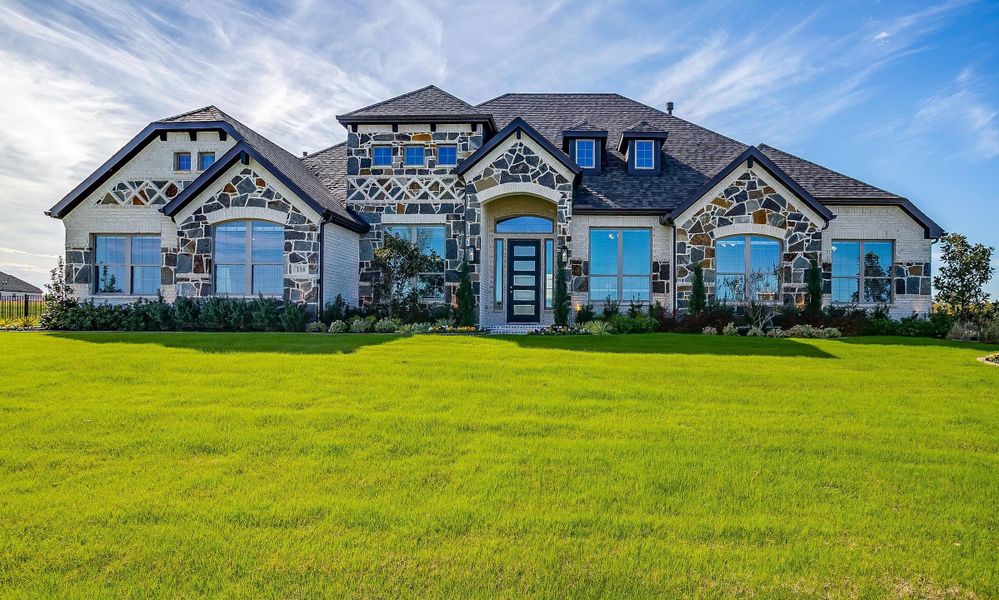 Front exterior of a new home in Heritage, McLendon-Chisholm, TX, highlighting curb appeal (Image 21).