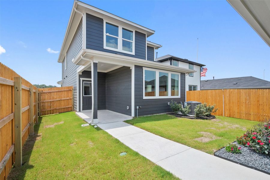 Front exterior of a new home in Valverde, Bastrop, TX, highlighting curb appeal (Image 2).