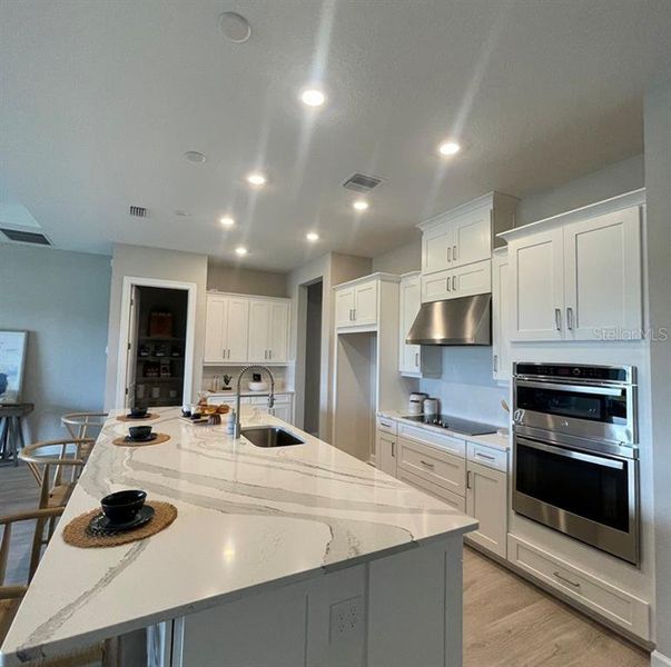 Furnished interior view inside a new home in Westview Community Group Page, Kissimmee (Image 13).