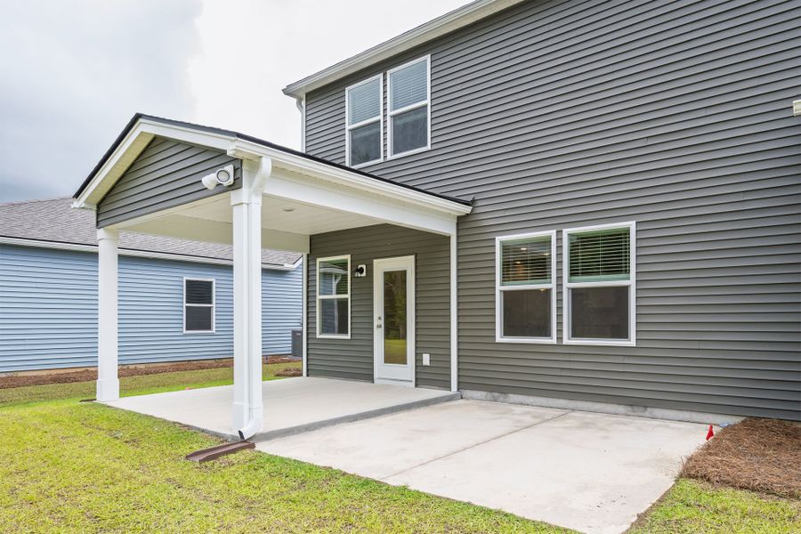 Backyard with stunning Pond Views and covered patio. Backyard with stunning Pond Views and covered patio.