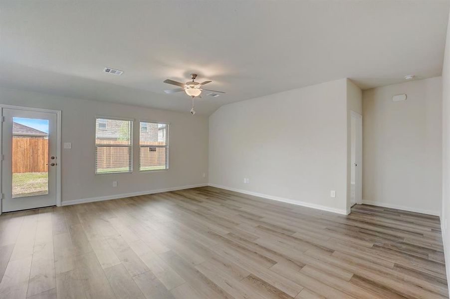 Unfurnished room featuring ceiling fan and light hardwood / wood-style floors