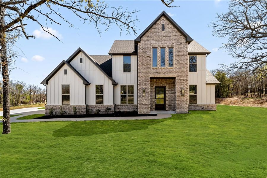 Front exterior of a new home in Spring Valley Ranch, Paradise, TX, highlighting curb appeal (Image 1). Front exterior of a new home in Spring Valley Ranch, Paradise, TX, highlighting curb appeal (Image 1).