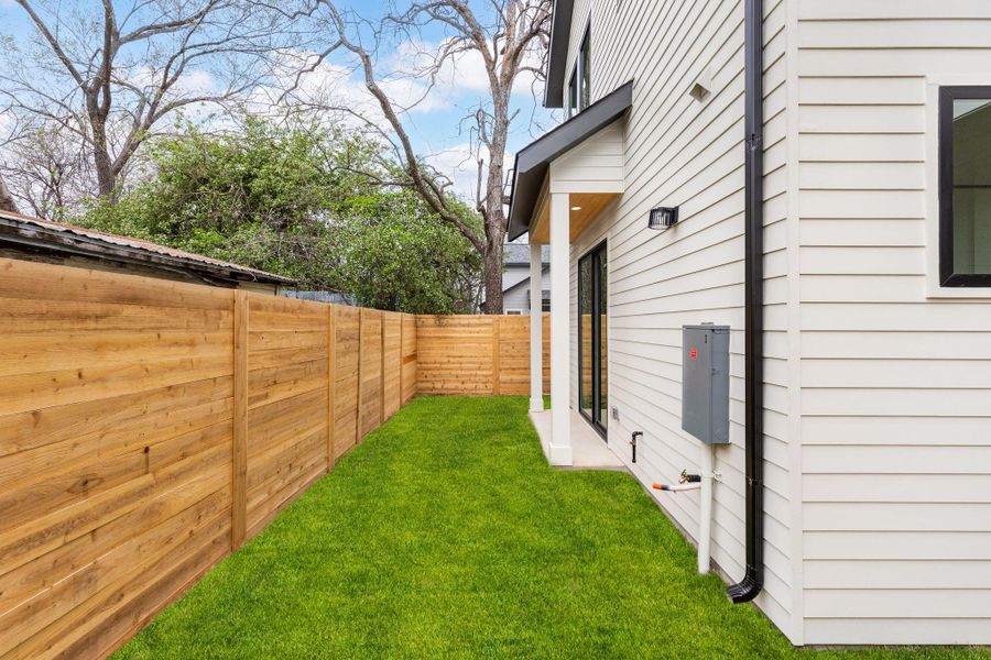 View of fenced backyard