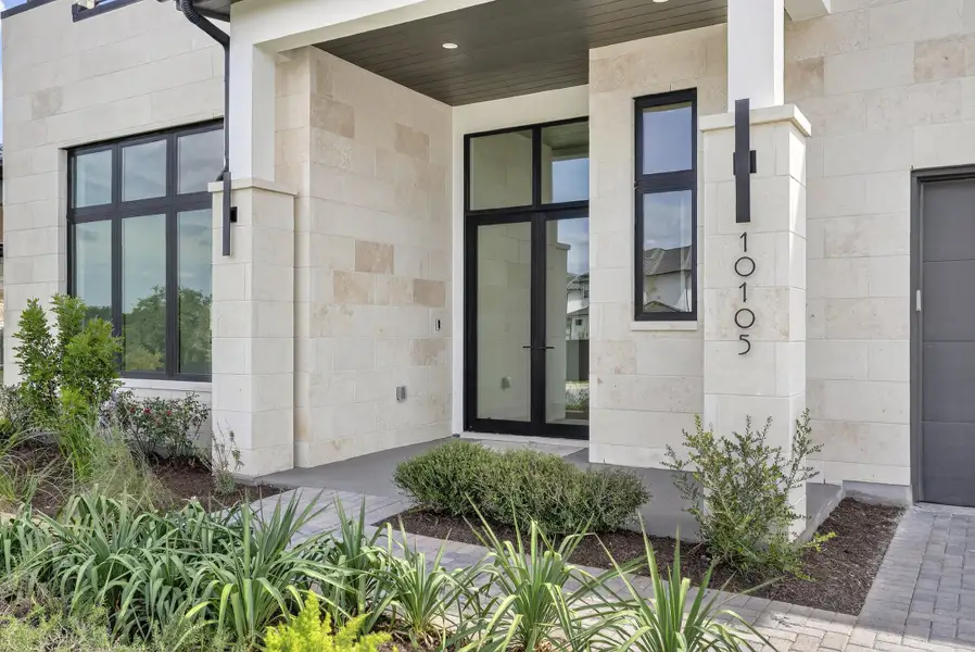 Exterior details and patio area of a home in Milky Way at River Place, Austin (Image 2).