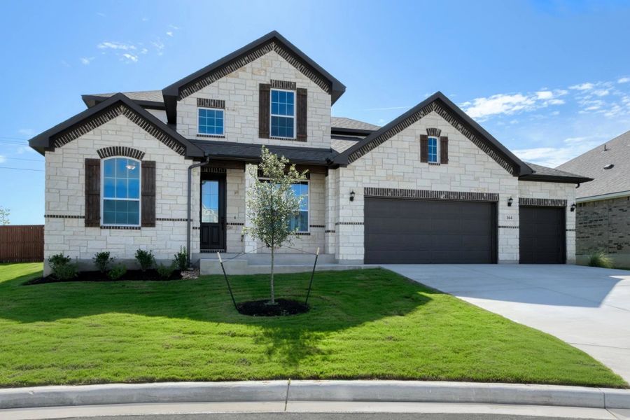 Representative exterior photo of a completed home built from the Nathaniel by Ashton Woods in Megan's Landing 70's, Castroville, TX (Image 24).