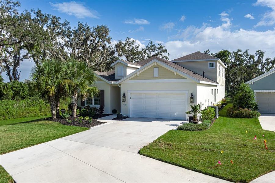 Front exterior of a new home in , Parrish, FL, highlighting curb appeal (Image 2).