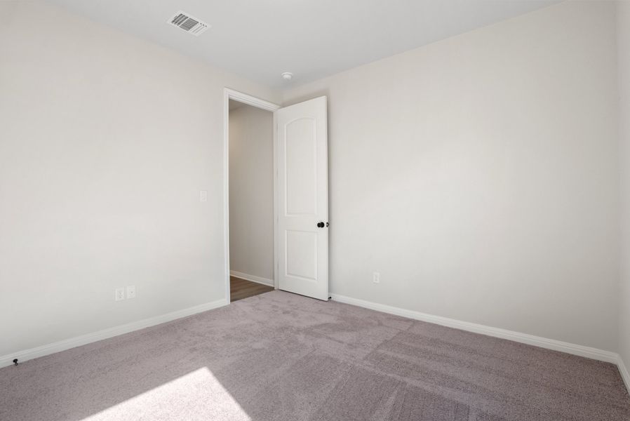 Representative unfurnished interior of a home built from the Texoma by Ashton Woods in The Colony 50s, Bastrop (Image 29).