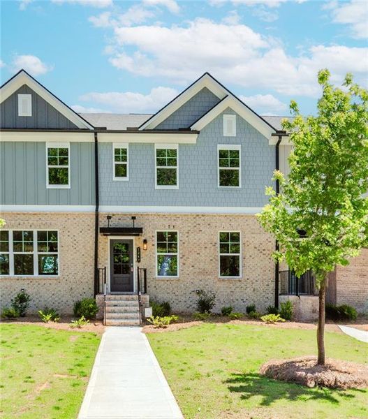 Front exterior of a new home in Hillcrest Landing, Sugar Hill, GA, highlighting curb appeal (Image 24). Front exterior of a new home in Hillcrest Landing, Sugar Hill, GA, highlighting curb appeal (Image 24).