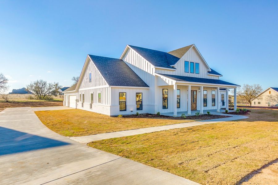 Representative exterior photo of a completed home built from the Ashwood Court House by Trinity Classic Homes in Zion Trails, Poolville, TX (Image 9). Representative exterior photo of a completed home built from the Ashwood Court House by Trinity Classic Homes in Zion Trails, Poolville, TX (Image 9).