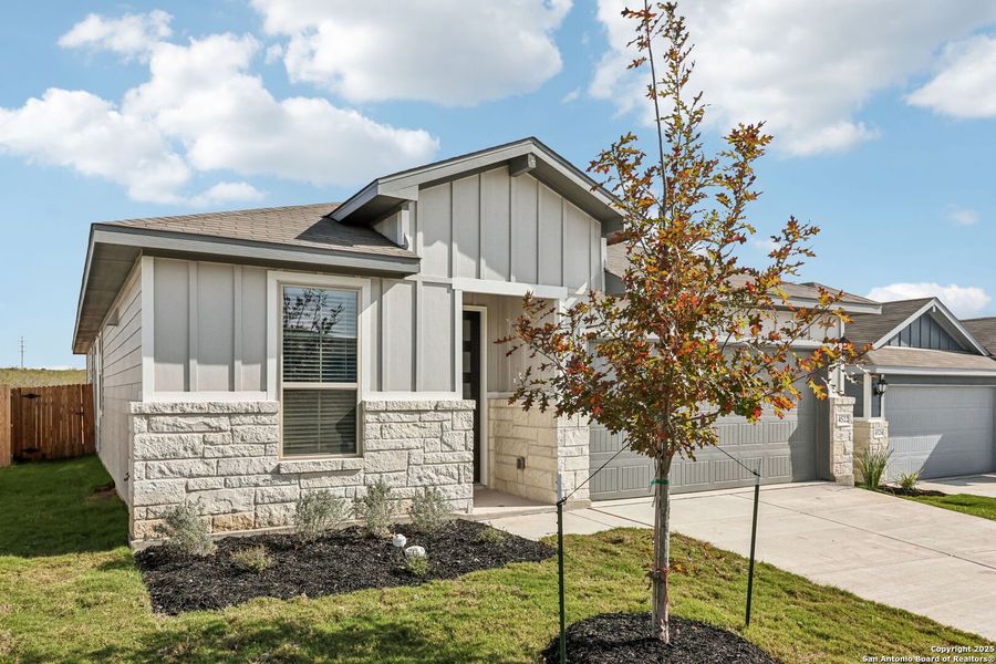 Front exterior of a new home in Remington Ranch, San Antonio, TX, highlighting curb appeal (Image 2). Front exterior of a new home in Remington Ranch, San Antonio, TX, highlighting curb appeal (Image 2).