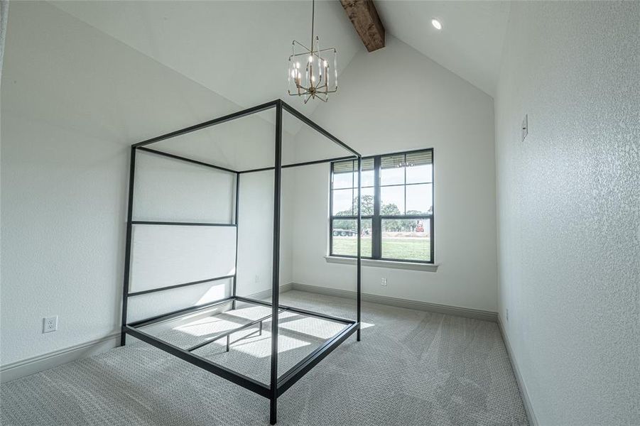 Unfurnished bedroom with a textured wall, a chandelier, beamed ceiling, carpet floors, and high vaulted ceiling Unfurnished bedroom with a textured wall, a chandelier, beamed ceiling, carpet floors, and high vaulted ceiling