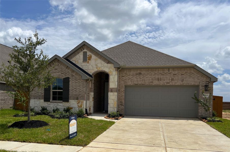Front exterior of a new home in Cypress Green, Hockley, TX, highlighting curb appeal (Image 1).