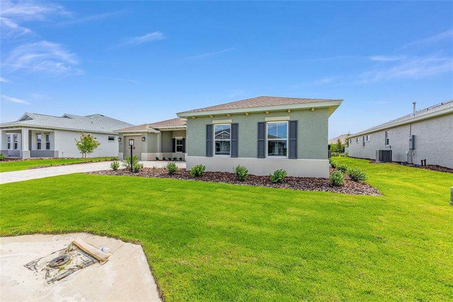 Front exterior of a new home in On Top of the World Communities, Ocala, FL, highlighting curb appeal (Image 22). Front exterior of a new home in On Top of the World Communities, Ocala, FL, highlighting curb appeal (Image 22).