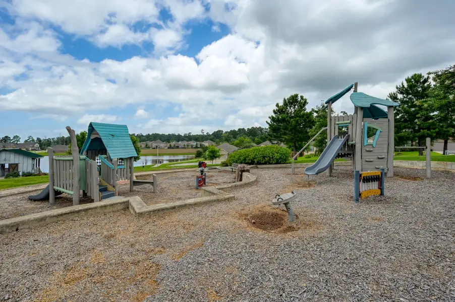 Family-friendly neighborhood playground overlooking the scenic community lake, providing a fun outdoor space for children to play while residents enjoy the beautiful surroundings and waterfront views. Family-friendly neighborhood playground overlooking the scenic community lake, providing a fun outdoor space for children to play while residents enjoy the beautiful surroundings and waterfront views.