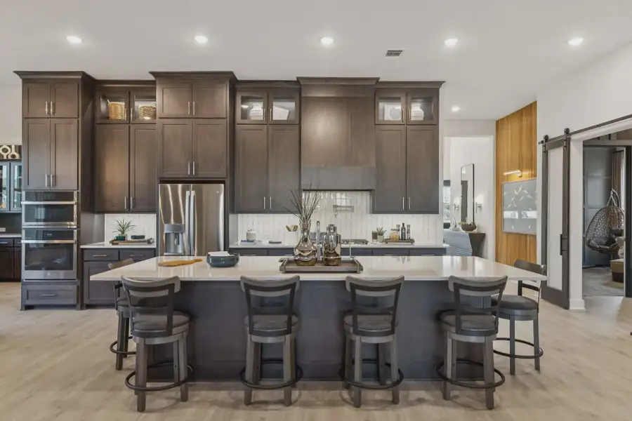 Representative furnished interior of a home built from the Sweetwater II by Chesmar Homes in Trinity Falls, McKinney (Image 6).