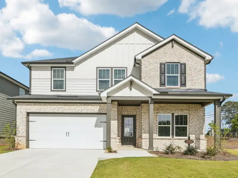 Front exterior of a new home in Martin Springs - Estate Series, Lawrenceville, GA, highlighting curb appeal (Image 1).
