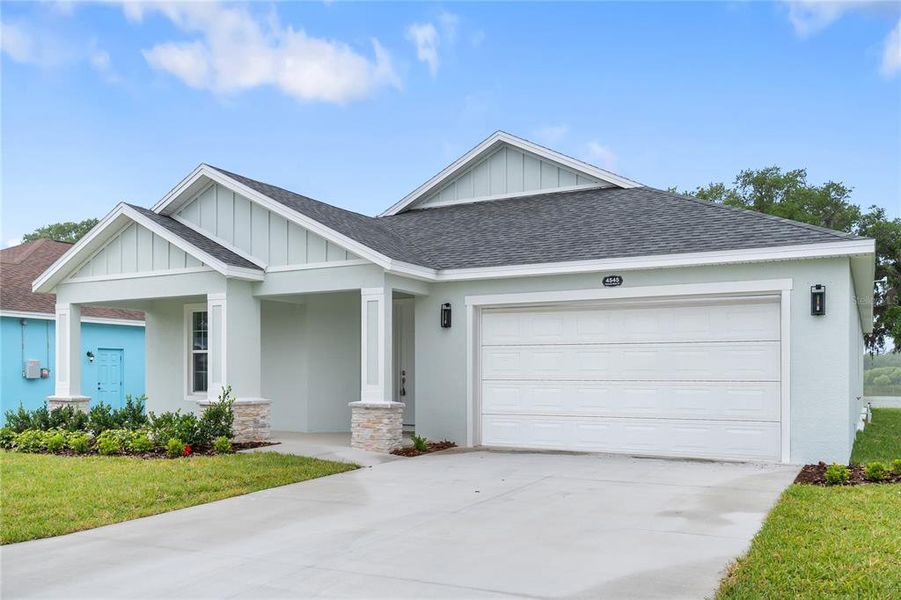 Front exterior of a new home in , Mulberry, FL, highlighting curb appeal (Image 1). Front exterior of a new home in , Mulberry, FL, highlighting curb appeal (Image 1).