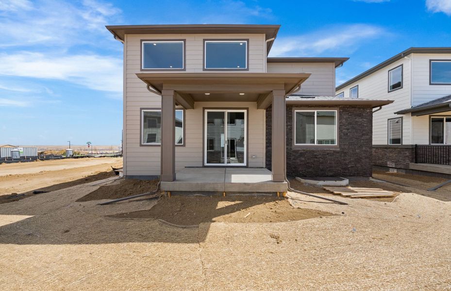 Exterior details and patio area of a home in Harvest Crossing, Aurora (Image 21).