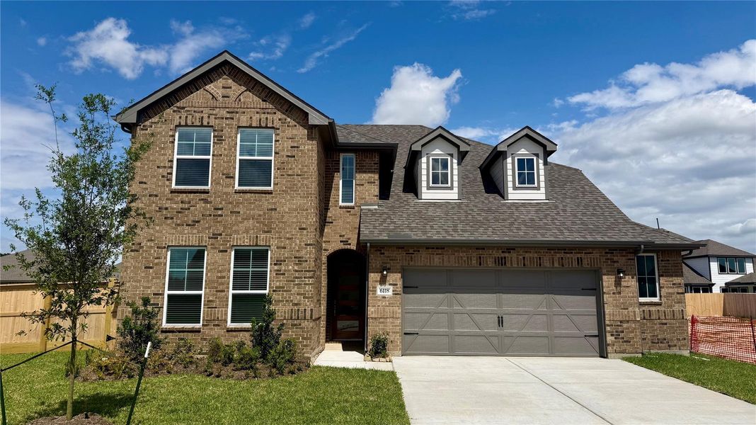 Front exterior of a new home in , Katy, TX, highlighting curb appeal (Image 2). Front exterior of a new home in , Katy, TX, highlighting curb appeal (Image 2).