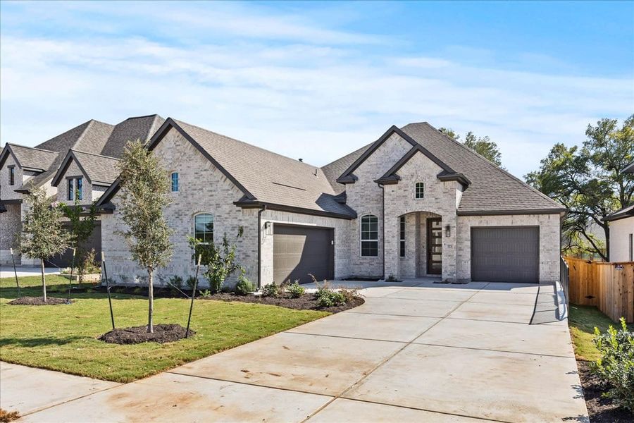 Front exterior of a new home in 6 Creeks, Kyle, TX, highlighting curb appeal (Image 19). Front exterior of a new home in 6 Creeks, Kyle, TX, highlighting curb appeal (Image 19).