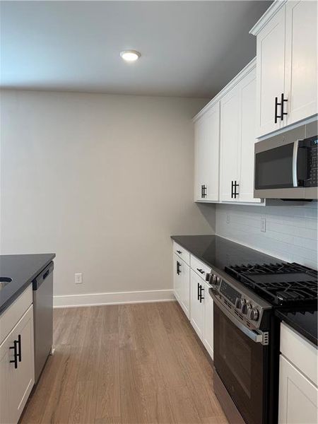 Furnished interior view inside a new home in The Fairways at Mirror Lake, Villa Rica (Image 6).