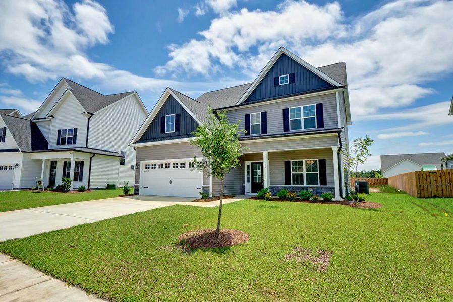 Representative exterior photo of a completed home built from the Cedar by American Homesmith in Plantation Harbor Havelock, Land O' Lakes, FL (Image 1).