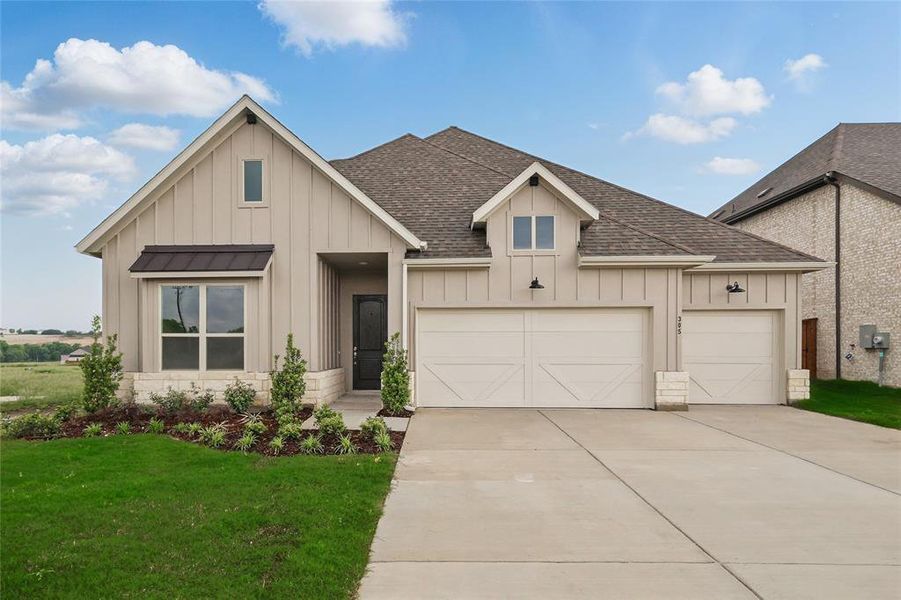 View of front of property with board and batten siding, roof with shingles, concrete driveway, a garage, and a front yard View of front of property with board and batten siding, roof with shingles, concrete driveway, a garage, and a front yard
