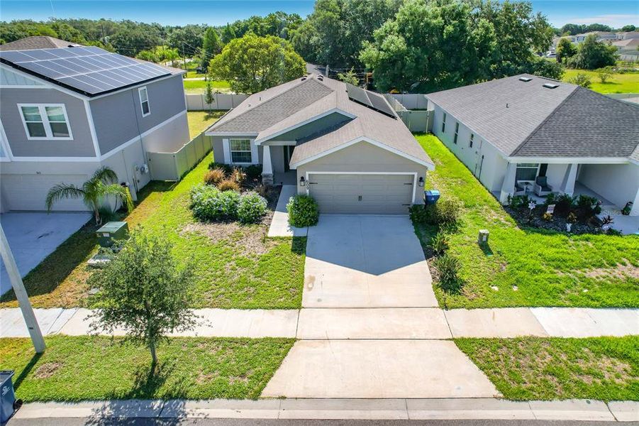 Front exterior of a new home in Bradbury Creek, Haines City, FL, highlighting curb appeal (Image 2). Front exterior of a new home in Bradbury Creek, Haines City, FL, highlighting curb appeal (Image 2).
