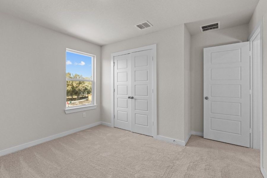 A room with white doors and a window. A room with white doors and a window.