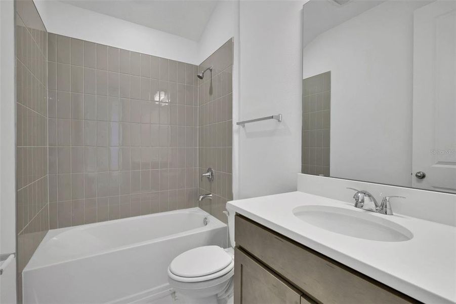 Furnished interior view inside a new home in Serenade at Ovation, Winter Garden (Image 12).