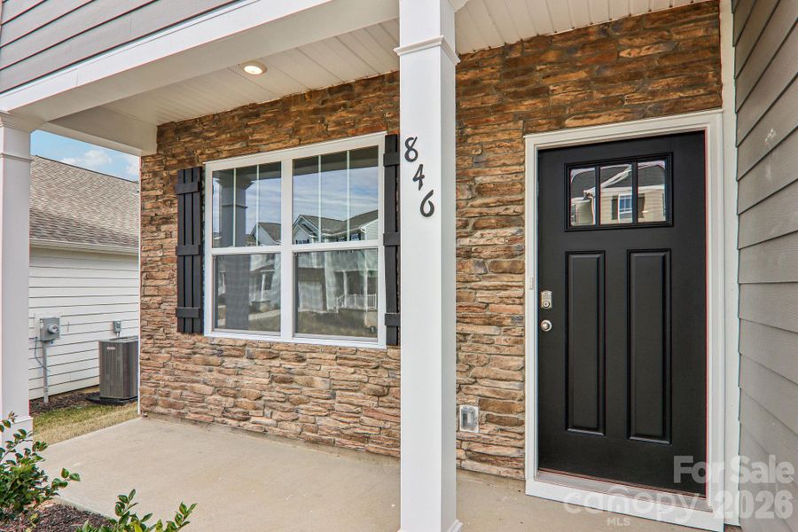 Exterior details and patio area of a home in Rydele Heights, Asheville (Image 4). Exterior details and patio area of a home in Rydele Heights, Asheville (Image 4).