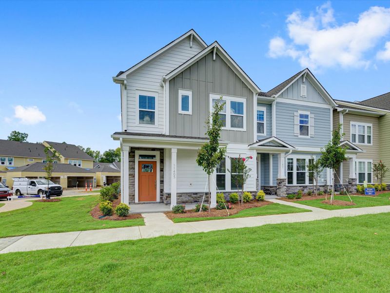 Front exterior of a new home in North Creek Village - Townhomes, Huntersville, NC, highlighting curb appeal (Image 20).