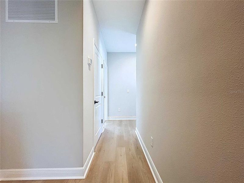 hallway to guest beds and bath