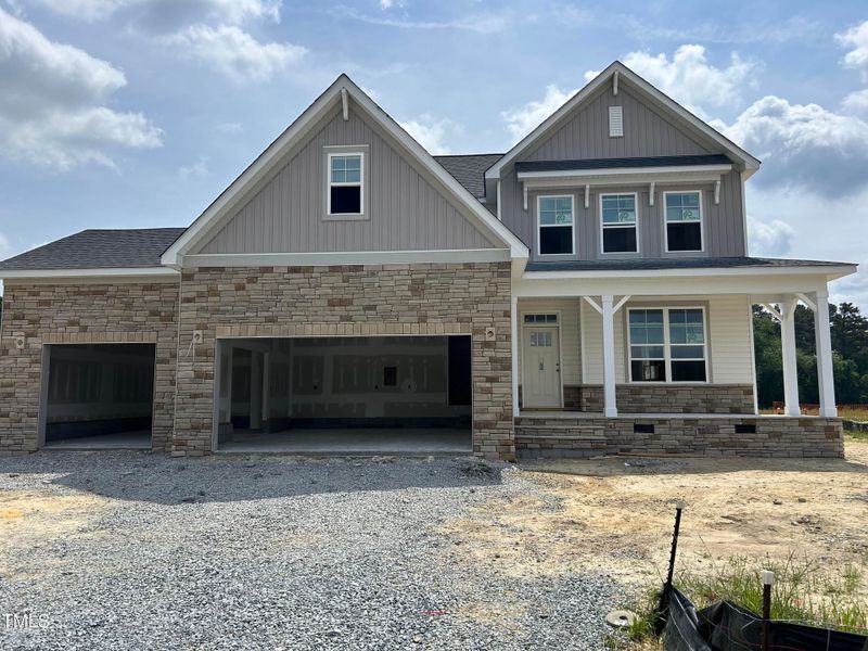 Front exterior of a new home in Tobacco Road, Angier, NC, highlighting curb appeal (Image 58). Front exterior of a new home in Tobacco Road, Angier, NC, highlighting curb appeal (Image 58).