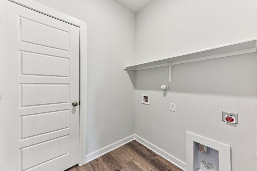 A white door with a white wall.