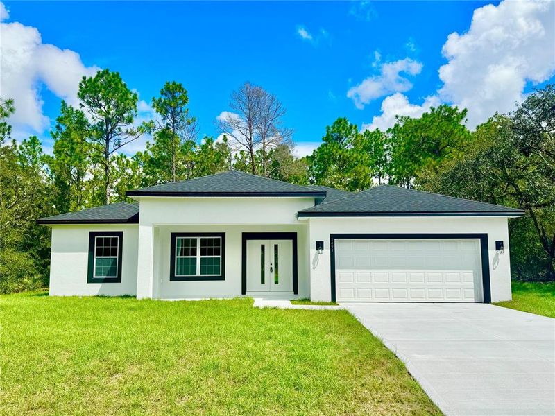 Front exterior of a new home in , Citrus Springs, FL, highlighting curb appeal (Image 17).