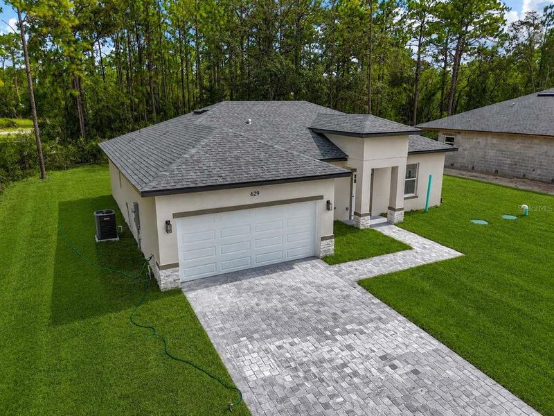 Front exterior of a new home in , Citrus Springs, FL, highlighting curb appeal (Image 2). Front exterior of a new home in , Citrus Springs, FL, highlighting curb appeal (Image 2).