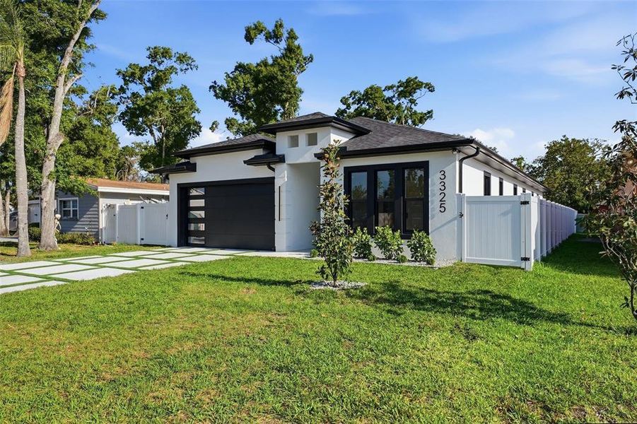 Front exterior of a new home in , St. Petersburg, FL, highlighting curb appeal (Image 28).