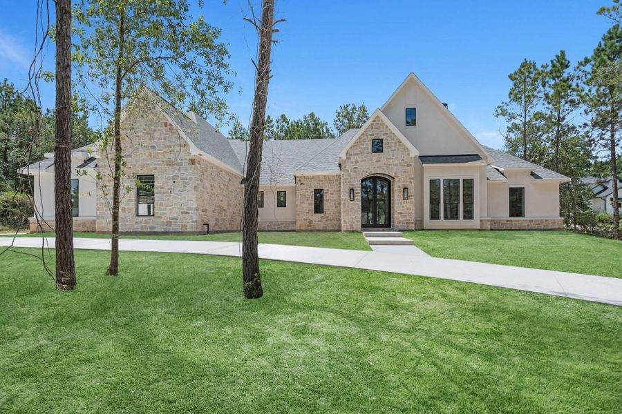 Front exterior of a new home in , Montgomery, TX, highlighting curb appeal (Image 24). Front exterior of a new home in , Montgomery, TX, highlighting curb appeal (Image 24).