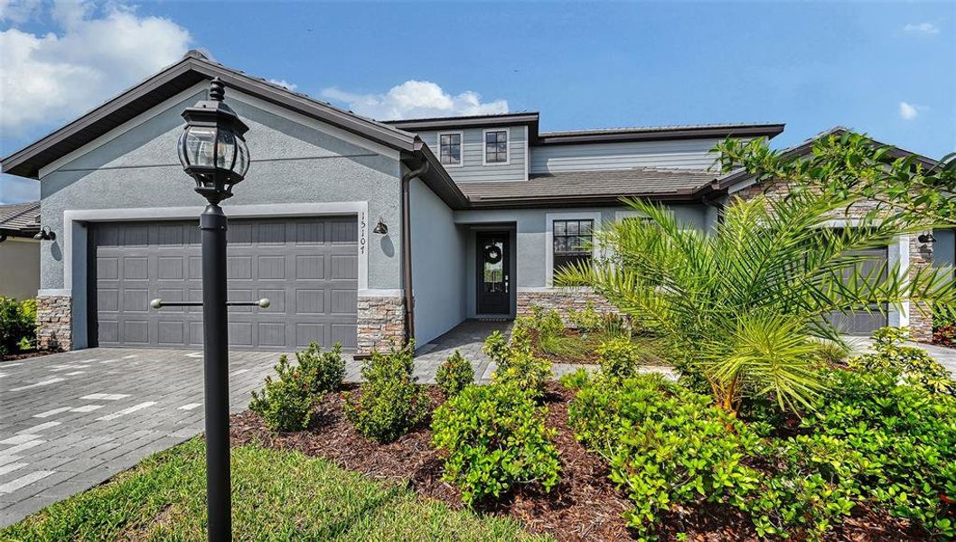 Front exterior of a new home in , Bradenton, FL, highlighting curb appeal (Image 23).