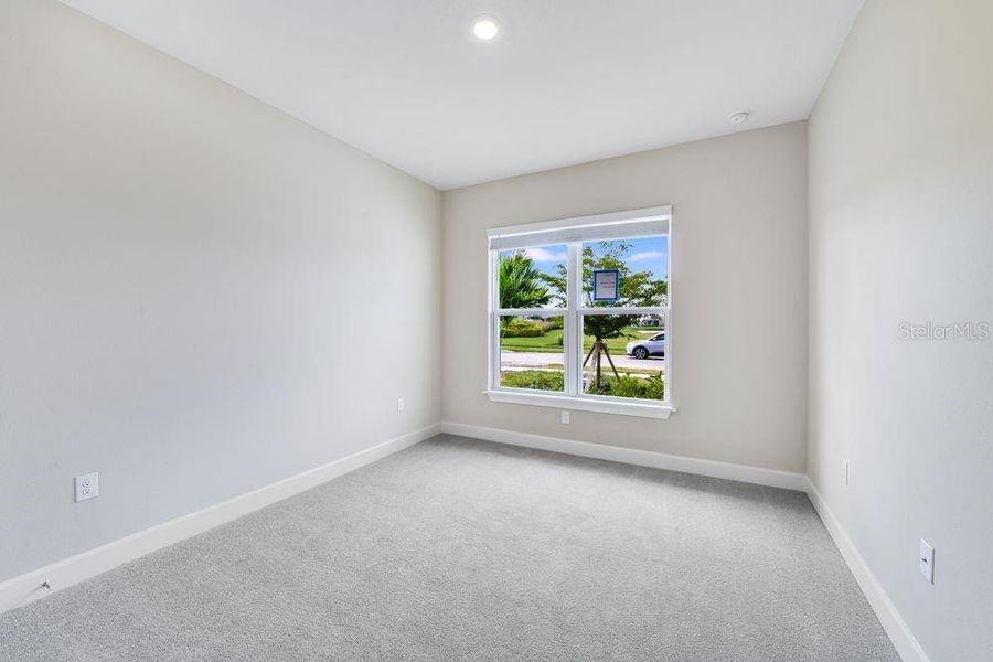 Spacious, unfurnished interior of a new home in Esplanade at Skye Ranch, Sarasota (Image 21).