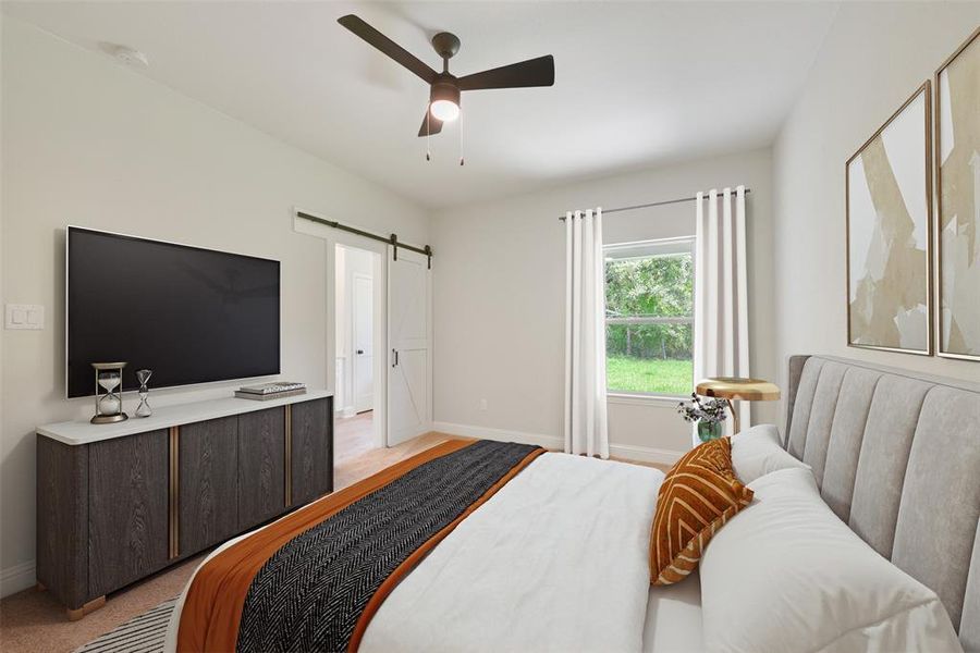 Primary bedroom  has a sliding barn door for added charm and a view of greenery through the window, providing a comfortable and serene space.  *Virtually Staged*