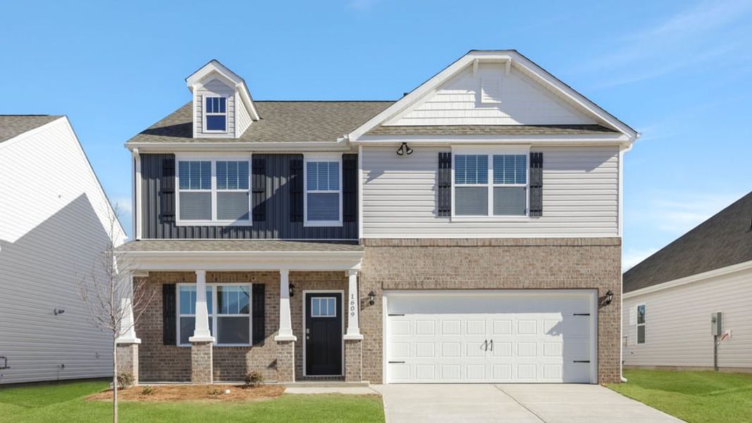 Front exterior of a new home in Sage Grove, Lyman, SC, highlighting curb appeal (Image 1). Front exterior of a new home in Sage Grove, Lyman, SC, highlighting curb appeal (Image 1).