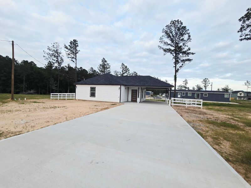 Exterior details and patio area of a home in , Conroe (Image 12).